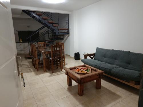 a living room with a couch and a table at Refugio del Este in San Martín