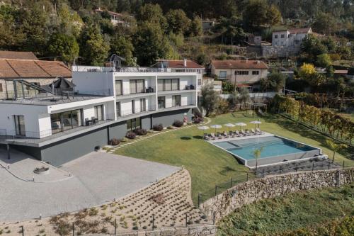 an aerial view of a house with a swimming pool at Ermal Terrace in Vieira do Minho