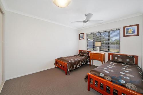 Postel nebo postele na pokoji v ubytování 27 Bauhinia Street