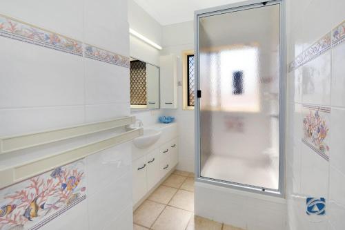 a bathroom with a shower and a sink at 25 The Esplanade in Woodgate