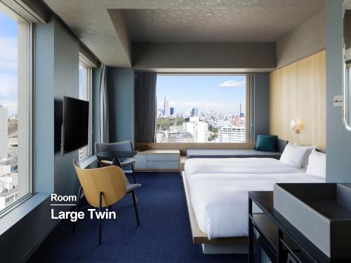 a hotel room with a large bed and a large window at sequence MIYASHITA PARK - Shibuya in Tokyo