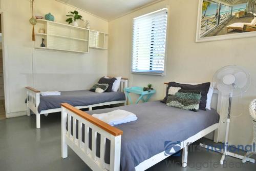 Ένα ή περισσότερα κρεβάτια σε δωμάτιο στο 10 Fifth Avenue