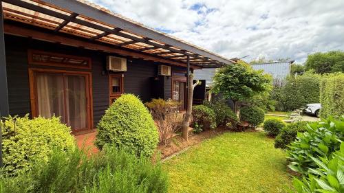 Κήπος έξω από το Departamentos de turismo - Apart Hotel MiCasa