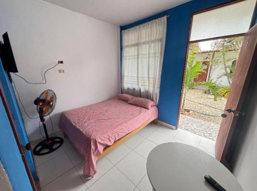 Postel nebo postele na pokoji v ubytování Hospedaje Ocasos- Restaurante Mar de brasas