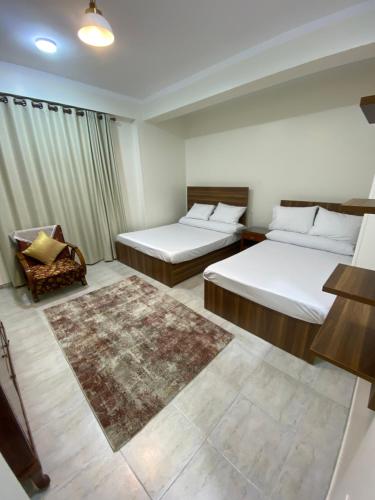 Postel nebo postele na pokoji v ubytování Tut Apartment