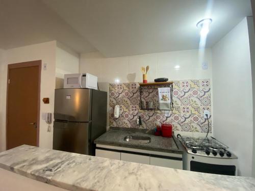 Een keuken of kitchenette bij Conforto e aconchego em São João del-Rei