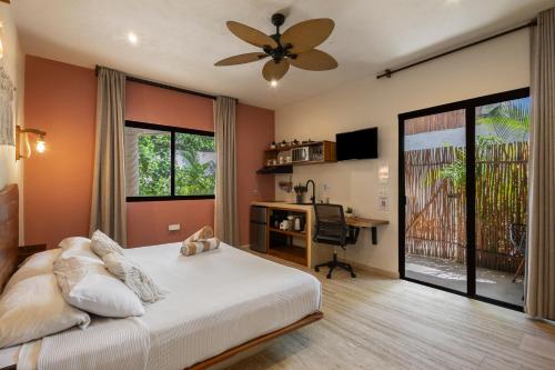 Ένα ή περισσότερα κρεβάτια σε δωμάτιο στο Casa Wayra Tulum