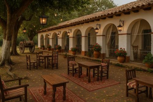 a group of tables and chairs in a courtyard at La querencia in Vaqueros