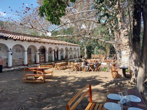 a group of tables and chairs in a courtyard at La querencia in Vaqueros