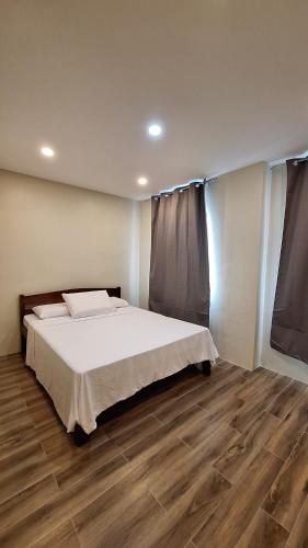 Ένα ή περισσότερα κρεβάτια σε δωμάτιο στο Richwood Homes