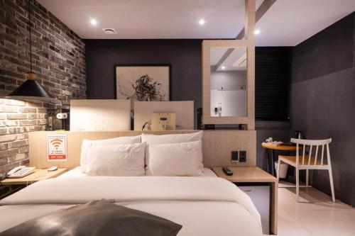 Ένα ή περισσότερα κρεβάτια σε δωμάτιο στο Hotel Yaja Sasang Terminal