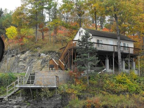 a house on the side of a hill with trees at Cliffside Hideaway-Renovations & upgrades coming! in Hammond