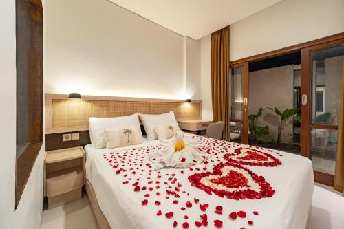 En eller flere senge i et værelse på The Hita Uluwatu