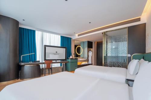 Postel nebo postele na pokoji v ubytování Licheng Bieyuan Meibao Hotel