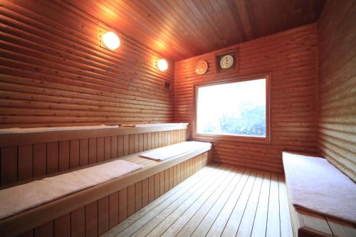a room with a sauna with a window at Shoho in Matsumoto
