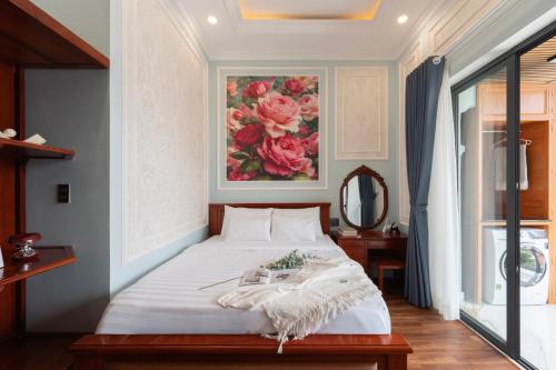 Ένα ή περισσότερα κρεβάτια σε δωμάτιο στο Ben Thanh Maison