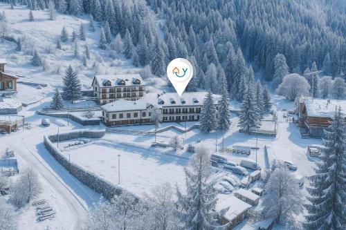 an aerial view of a building with a hot air balloon at Appartamento La Selva Incantata - Happy Rentals in Sauze d'Oulx