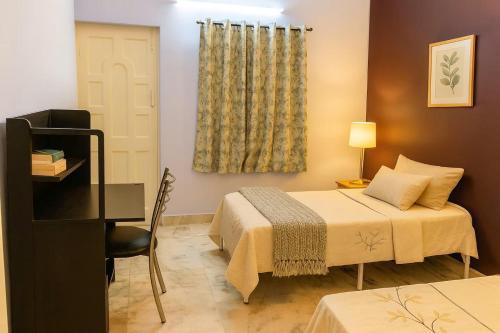 Ένα ή περισσότερα κρεβάτια σε δωμάτιο στο Grace Garden