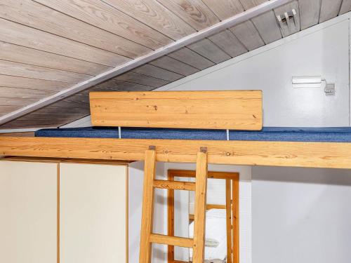 a loft bed in a tiny house at 6 person holiday home in Hanstholm- Type1 in Hanstholm