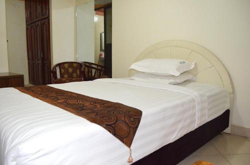 Postel nebo postele na pokoji v ubytování Mt. Zion Hotel Annex