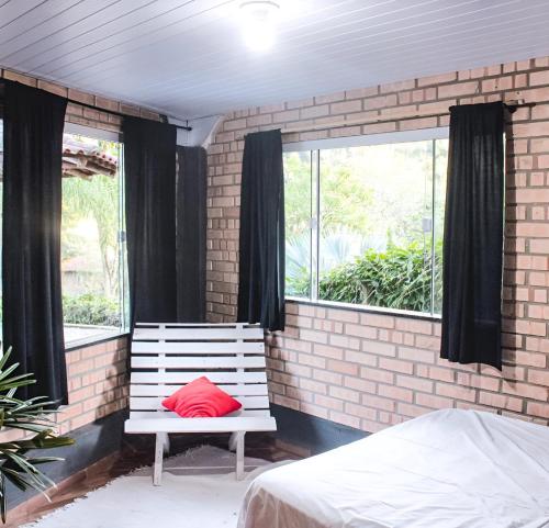 Ένα ή περισσότερα κρεβάτια σε δωμάτιο στο Sítio Costa Leite