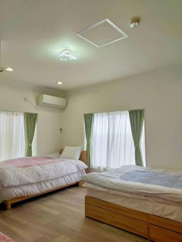 Postel nebo postele na pokoji v ubytování Villa Koedo