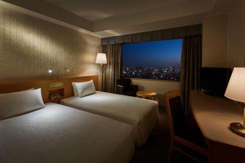 Un ou plusieurs lits dans un hébergement de l'établissement Tobu Hotel Levant Tokyo