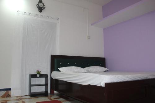 Ένα ή περισσότερα κρεβάτια σε δωμάτιο στο Morning Mist Home stay