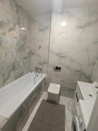 Koupelna v ubytování Апартаменти Ашан Автовокзал Стрийська