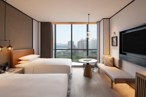 Ένα ή περισσότερα κρεβάτια σε δωμάτιο στο Sheraton Xi'an Chanba