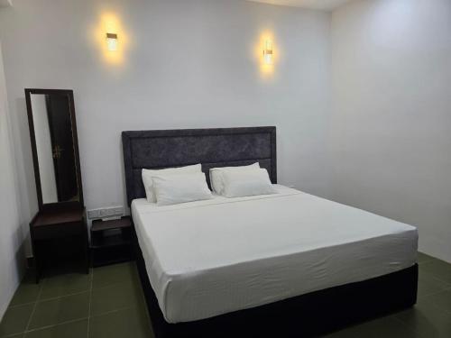 Ένα ή περισσότερα κρεβάτια σε δωμάτιο στο M-stay Colombo