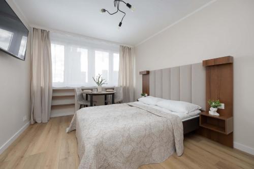 A Unique Studio with a Beautiful View of the Palace of Culture and Science by Noclegi Renters