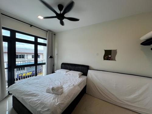 Postel nebo postele na pokoji v ubytování AP Homestay