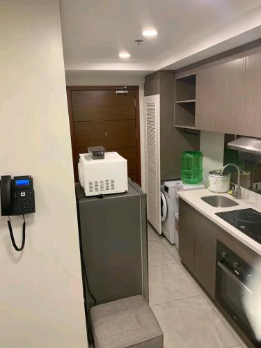 Η κουζίνα ή μικρή κουζίνα στο Aayah Staycation condo & Hotel