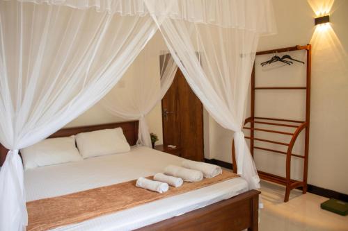 Postel nebo postele na pokoji v ubytování Lisa Villa Mirissa