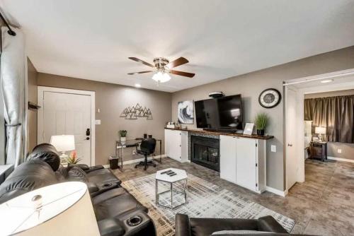 a living room with a couch and a tv at 1BD Condo HWY161-183 DFW South Irving - I63 in Sowers