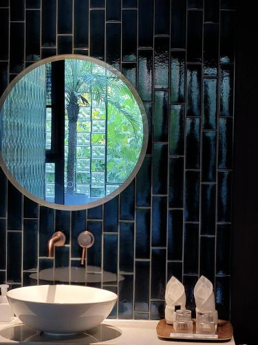 a bathroom with a sink and a mirror at Neobridge Hotel in Shanghai