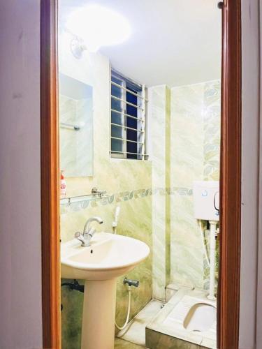a bathroom with a sink and a shower at Azul-Fully Furnished Modern Apartment in Bāiljuri