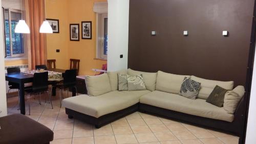 a living room with a couch and a table at Casa Vacanze Prato Verde in Zafferana Etnea