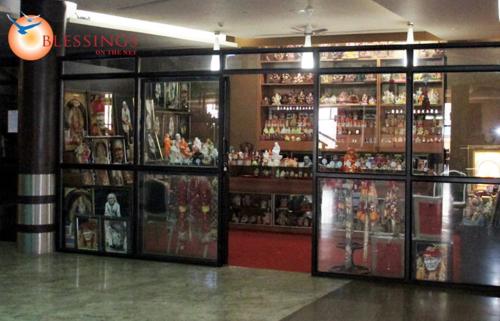 a store filled with lots of figurines on display at St Laurn The Spiritual Resort in Shirdi