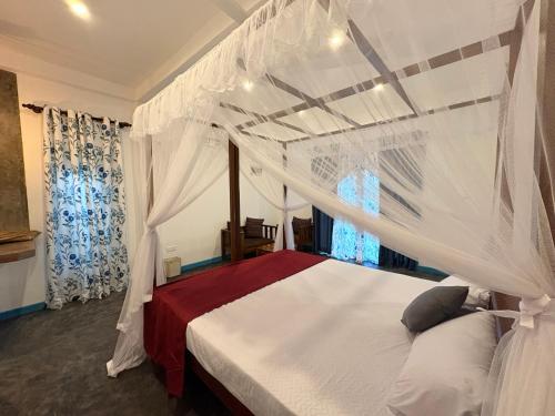 Postel nebo postele na pokoji v ubytování Ceylondra