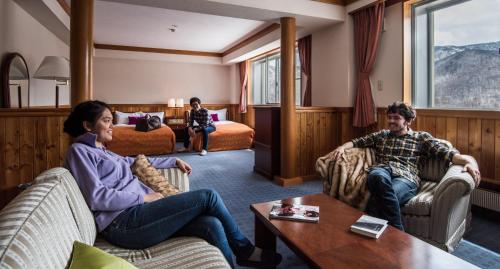 a group of people sitting in a hotel room at Okushiga Kogen Hotel in Yamanouchi
