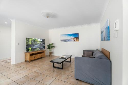 a living room with a couch and a table at Entire home in Southport Parade Southport in Gold Coast