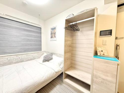 Una cama o camas en una habitación de Shinjuku downtown b3