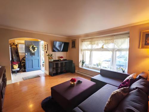 a living room with a couch and a table at Central Queen Anne Home, Walking Score 96 in Seattle