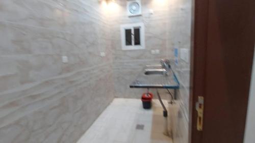 a bathroom with a shower and a sink in it at شقة غرفتين وصالة in Jeddah