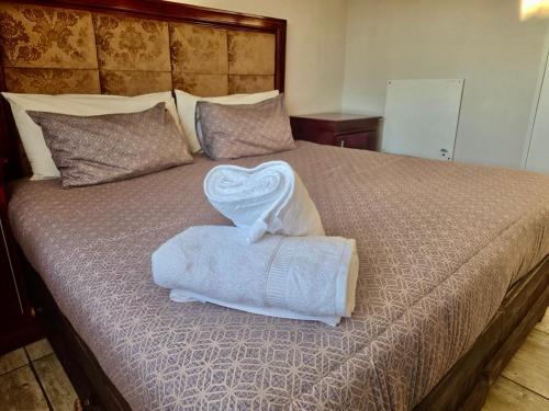 Ένα ή περισσότερα κρεβάτια σε δωμάτιο στο SapzRes at Taung