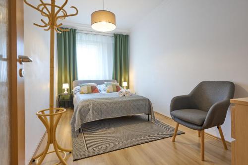 Postel nebo postele na pokoji v ubytování Klára Apartman - a belváros szívében