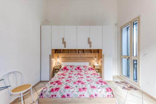 a bedroom with a large bed and a table and chairs at Mauricarol Residences in Acquarica del Capo