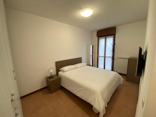 Postel nebo postele na pokoji v ubytování Appartamento La Triade